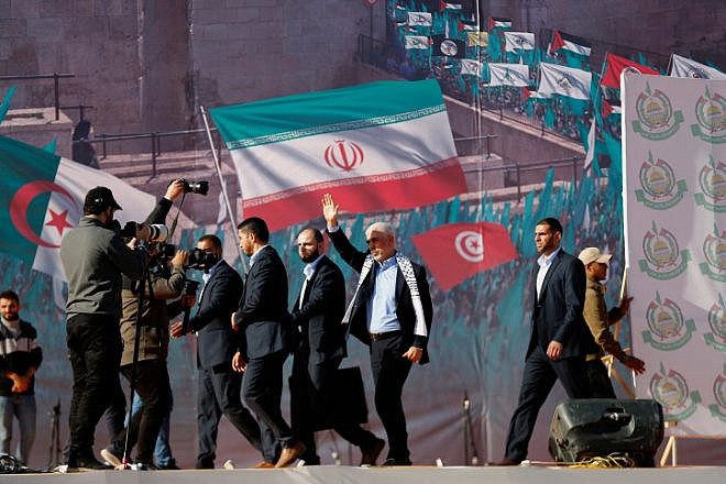 Yahya Sinwar (waving, with white scarf), leader of Hamas in the Gaza Strip, at a rally in Gaza marking the terrorist group's 35th anniversary, Dec. 14, 2022. Photo by Atia Mohammed/Flash90.