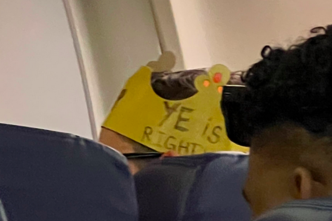 A Southwest Airlines passenger wearing a Burger King crown that states, "Ye is right." Credit: Twitter.