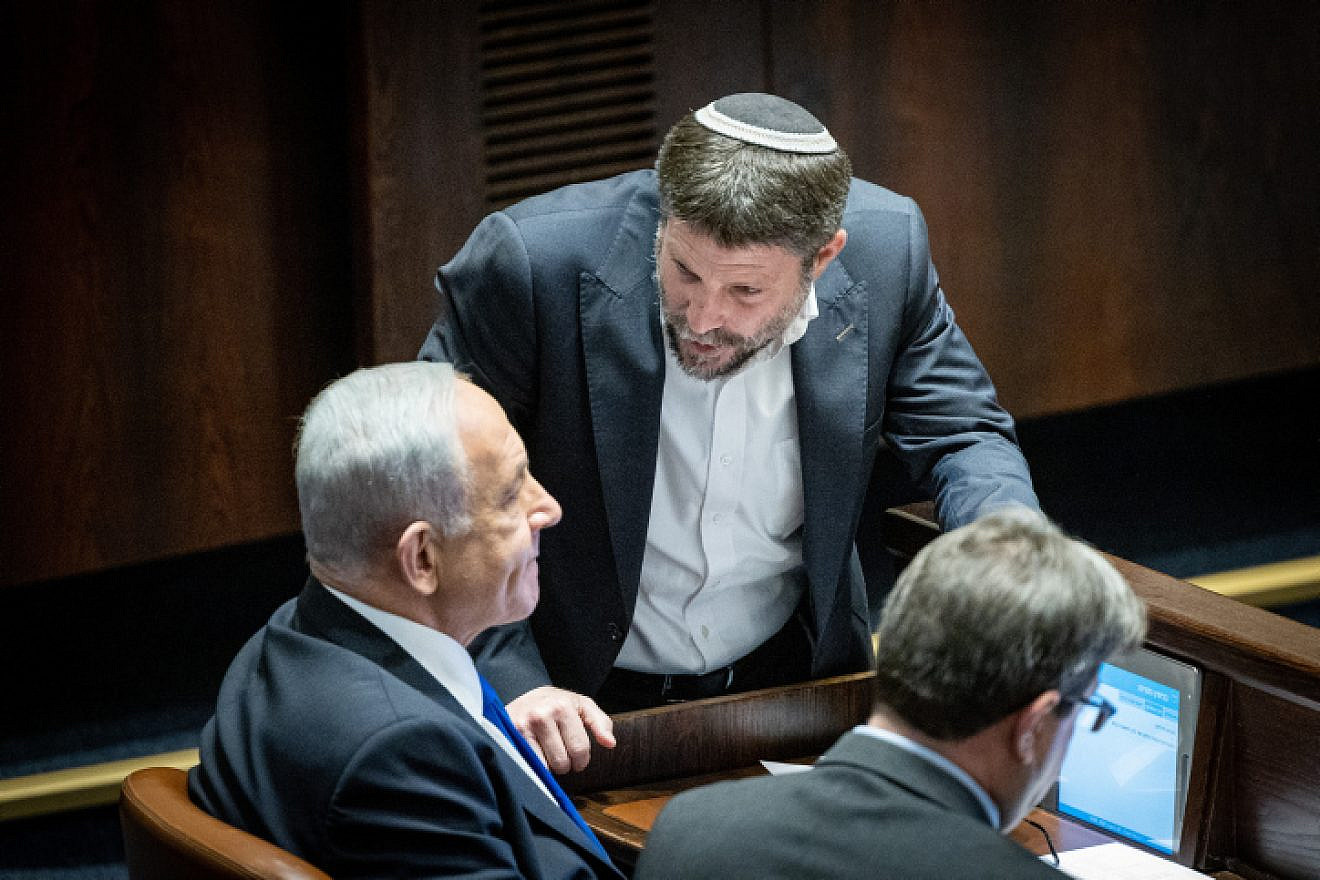 Israeli Prime Minister-designate Benjamin Netanyahu speaks with Religious Zionism Party head Bezalel Smotrich during a vote at the Knesset in Jerusalem, on Dec. 20, 2022. Photo by Yonatan Sindel/Flash90.