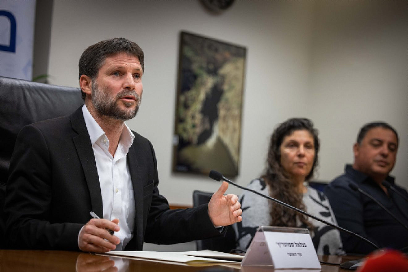 Israeli Finance Minister Bezalel Smotrich holds a press conference with bereaved families in the Ministry of Finance in Jerusalem, on Jan. 8, 2023. Photo by Yonatan Sindel/Flash90.