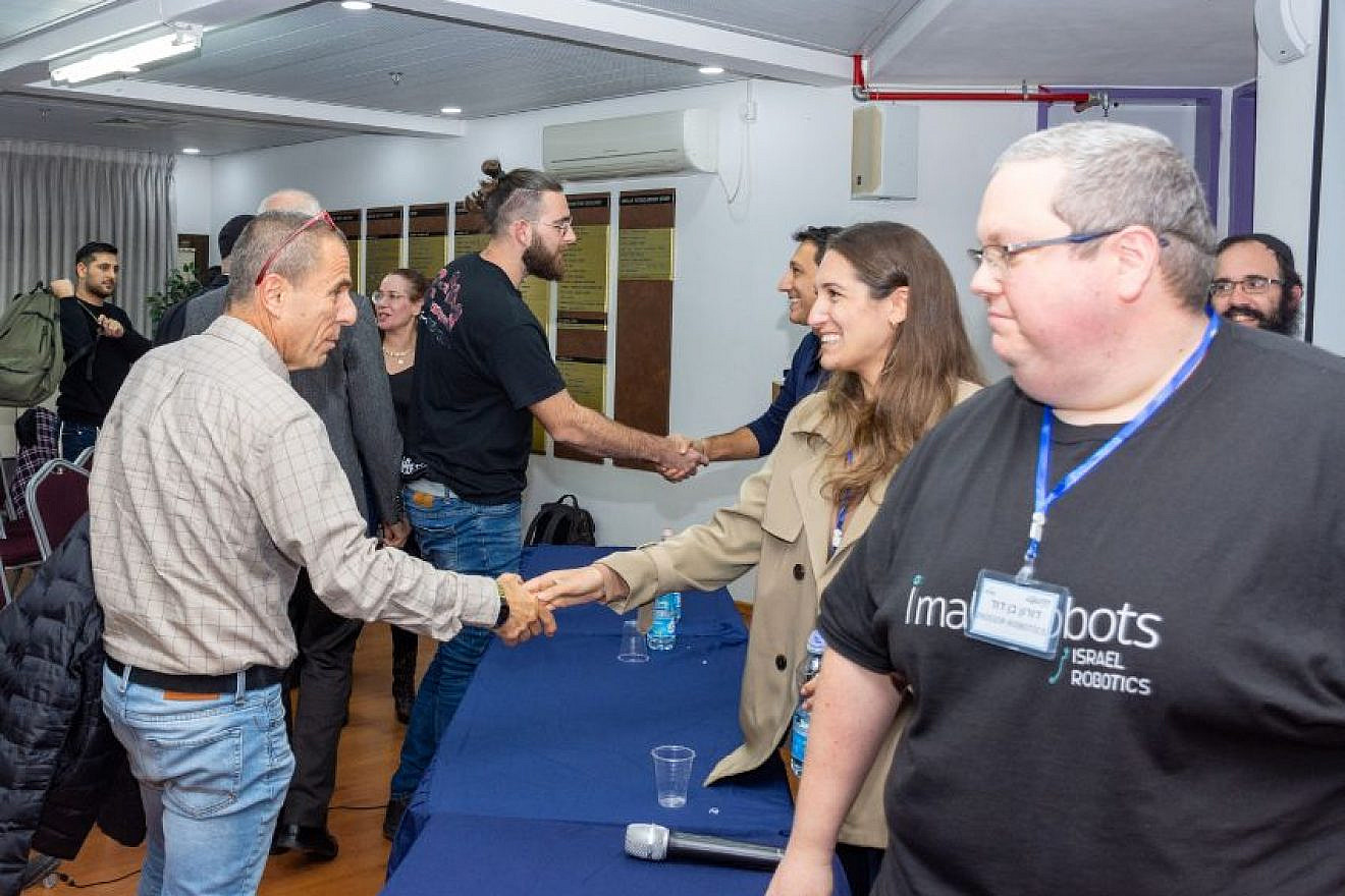 Panelists greet audience members at "The Real Step-by-Step Journey of a Start-Up" conference at the Braude College of Engineering, Karmiel, Jan. 9, 2023. Courtesy photo.
