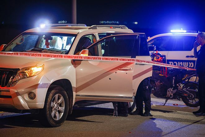 Israeli security personnel secure the scene of a shooting attack at the Bet Ha'arava Junction in the Jordan Valley, Feb. 27, 2023. Photo by Erik Marmor/Flash90.