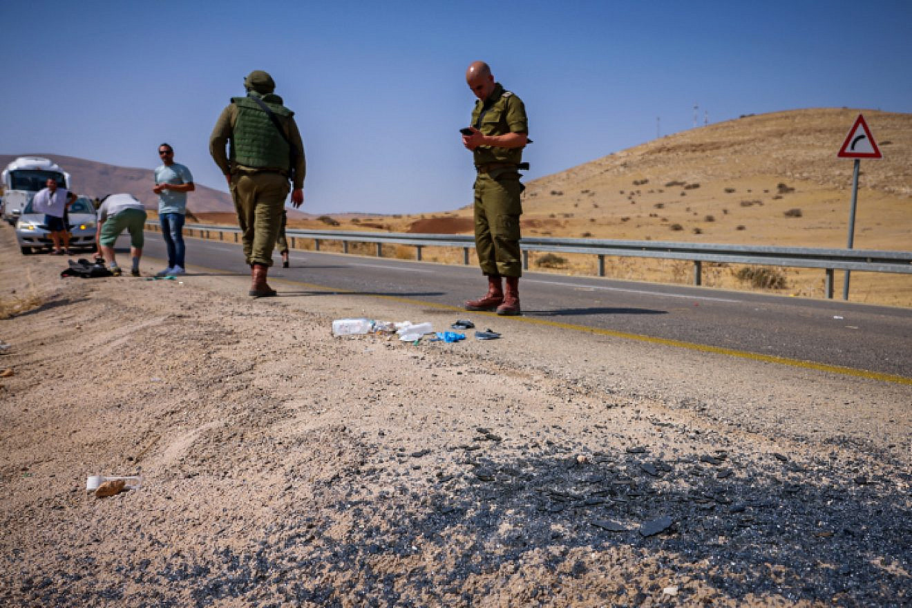 Security personnel at the scene of a shooting attack on a bus on Route 90 in the Jordan Valley, Sept. 4, 2022. Credit: Flash90.