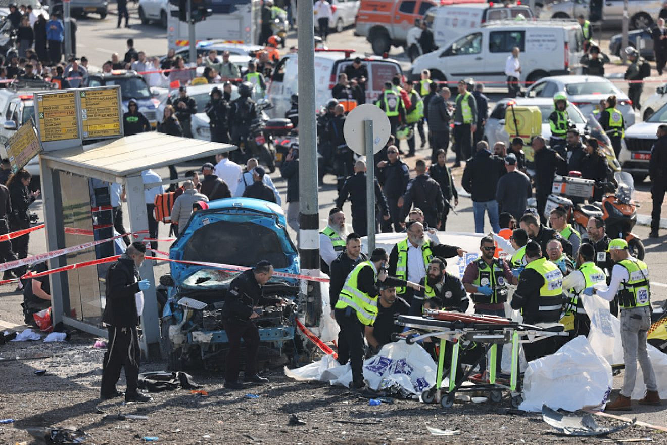 The scene in Jerusalem's Ramot neighborhood after an Israeli Arab drove a car into pedestrians there, Feb. 10, 2023. Photo by Yonatan Sindel/Flash90.