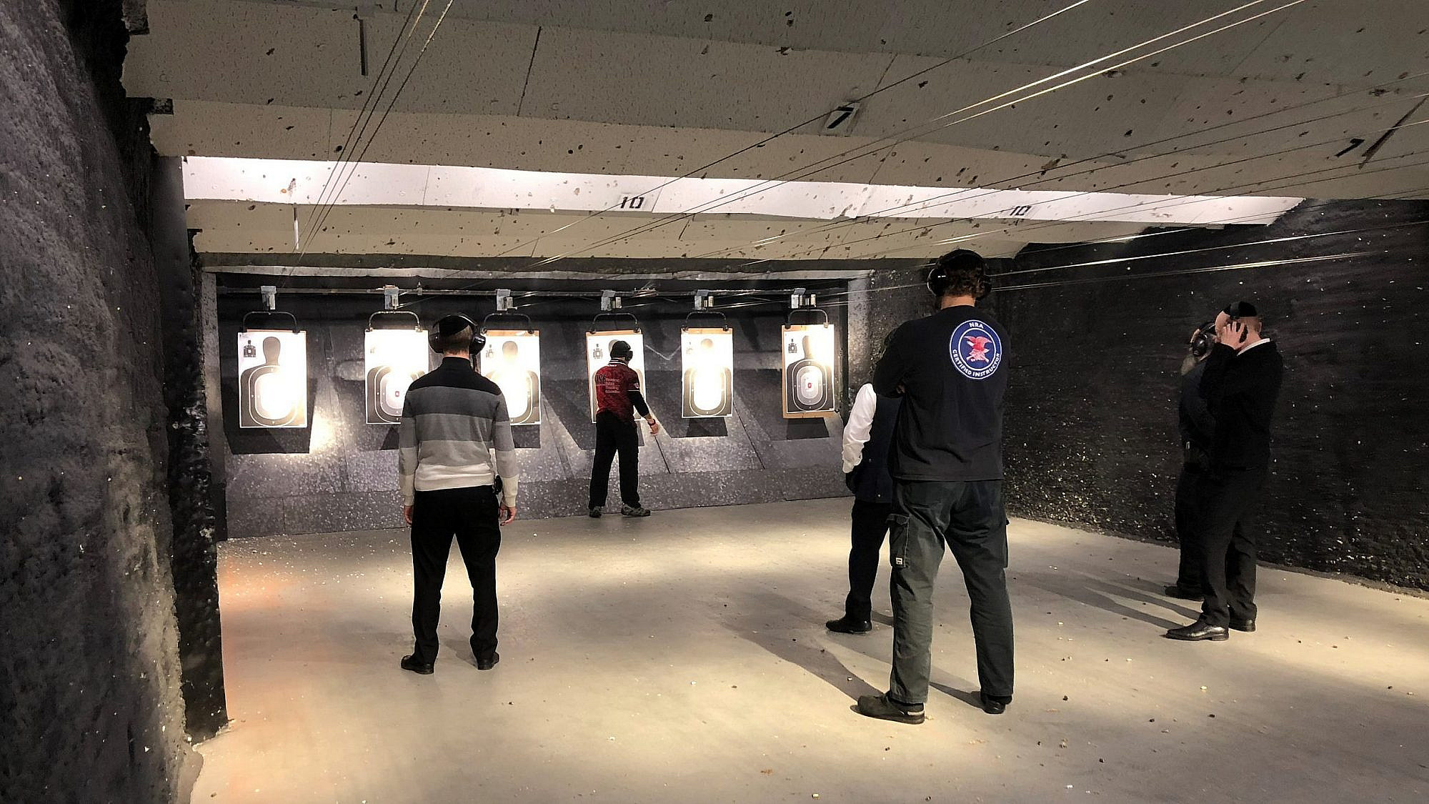 Members of NYS Jewish Gun Club practice at a firing range. Credit: Courtesy.