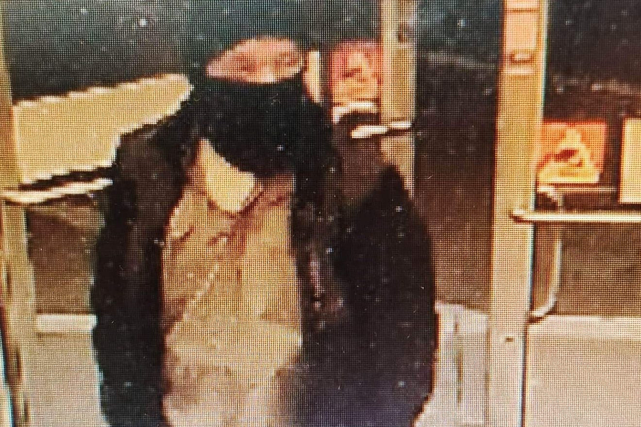 Image of a man in North Carolina wanted for waving a flag with a swastika on it outside of the Temple of the High Country. Credit: Town of Boone Police Department.