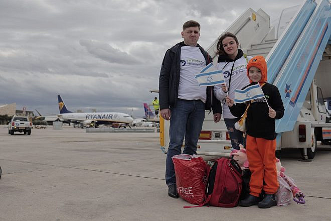 Sergei and Ludmilla Pumreykov and their eight-year-old daughter Ksenia at Ben-Gurion Airport, Feb. 8, 2023. Photo by Avishag Shaar-Yashuv/IFCJ.