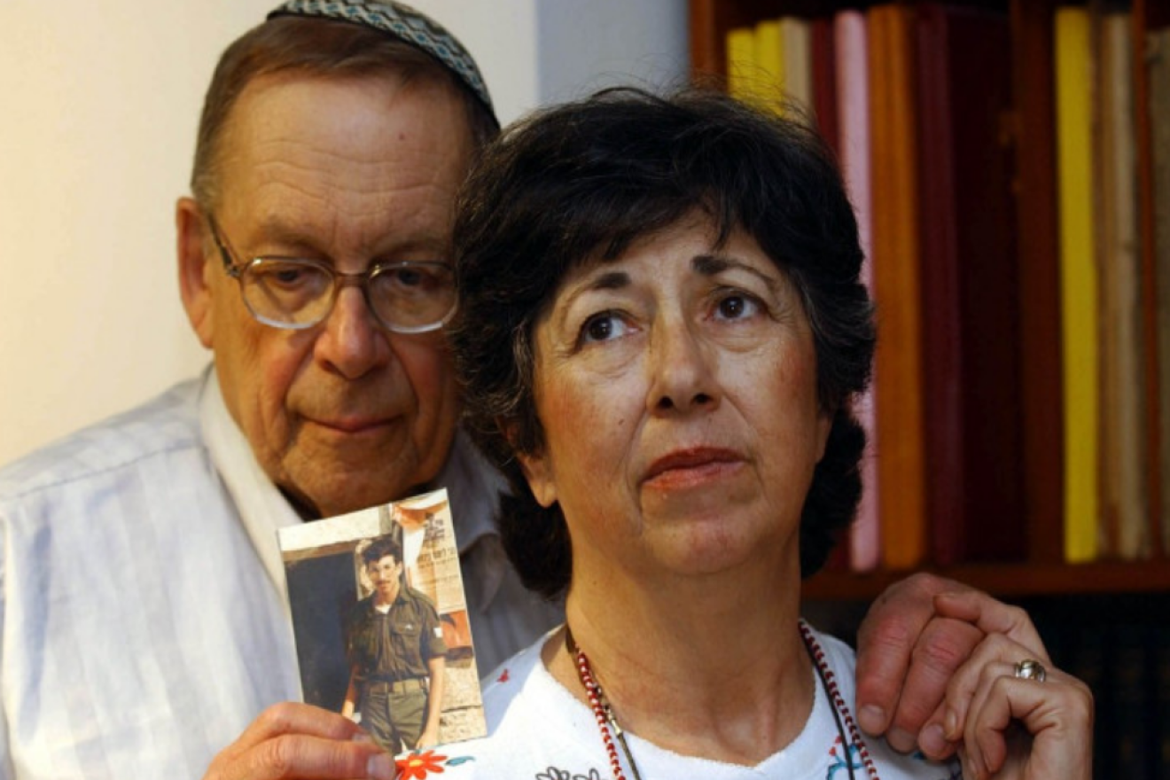 Yona and Miriam Baumel hold a picture of their missing son, Zachary. Credit: Courtesy.