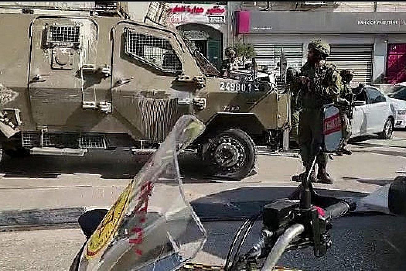 Soldiers secure the scene of a deadly shooting in Huwara, near Nablus, Feb. 26, 2023. Photo by Nasser Ishtayeh/Flash90.