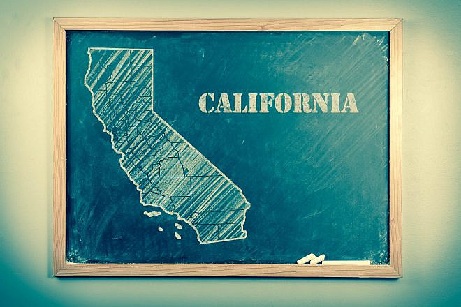 Outlined state of California on a school chalkboard. Credit: Ezume Images/Shutterstock.