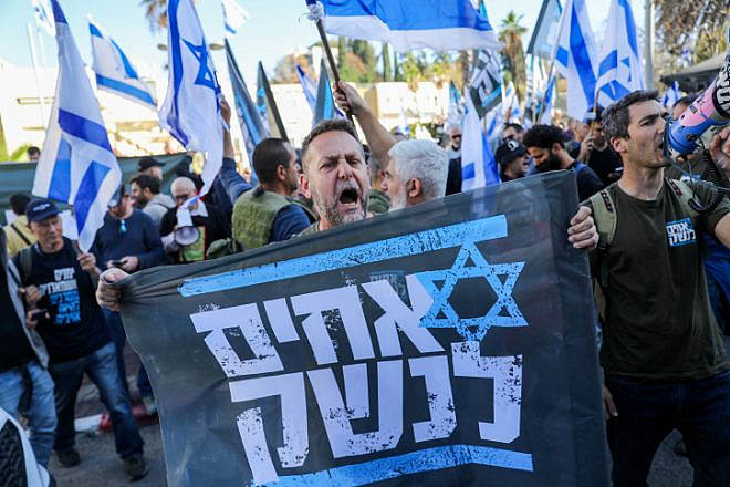 An Israel Defense Forces reservist from the Brothers in Arms protest group attends a demonstration against judicial reform in Bnei Brak, near Tel Aviv, March 16, 2023. Photo by Flash90.