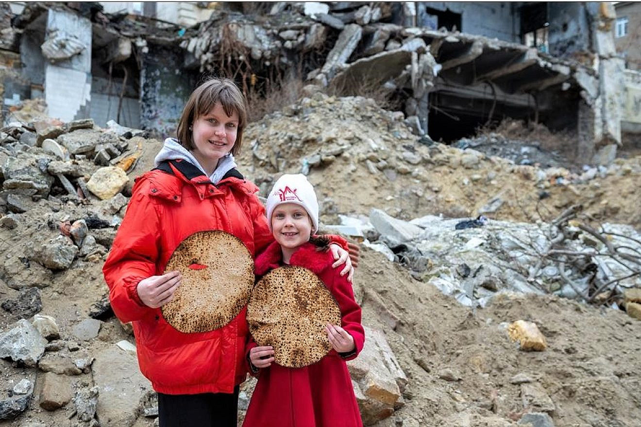 Jewish children in Ukraine hold up shmurah matzah ahead of the Passover seder. Credit: Jewish Relief Network Ukraine.