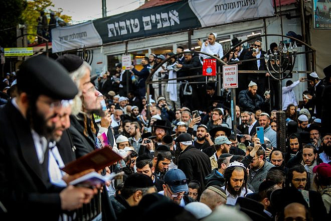 Jewish men in the street near the tomb of Reb Nachman of Breslov in Uman on eve of Rosh Hashanah, Sept. 25, 2022. Credit: Flash90.