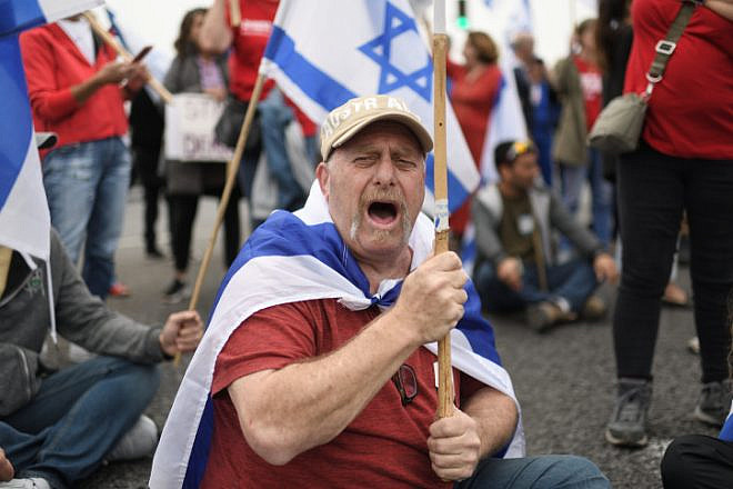 Israeli protesters against judicial reform block a main road on March 23, 2023. Photo by Gili Yaari/Flash90.