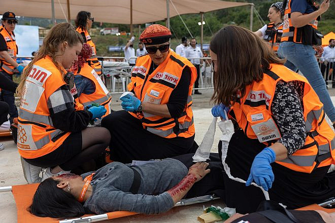 United Hatzalah women volunteers treat a “victim” in a simulation of a mass-casualty training event in April 2023. Credit: Courtesy.