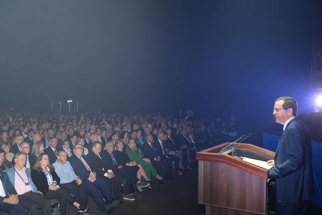 President Isaac Herzog addresses the JFNA General Assembly in Tel Aviv, April 23, 2023. Photo by Amos Ben-Gershom/GPO.