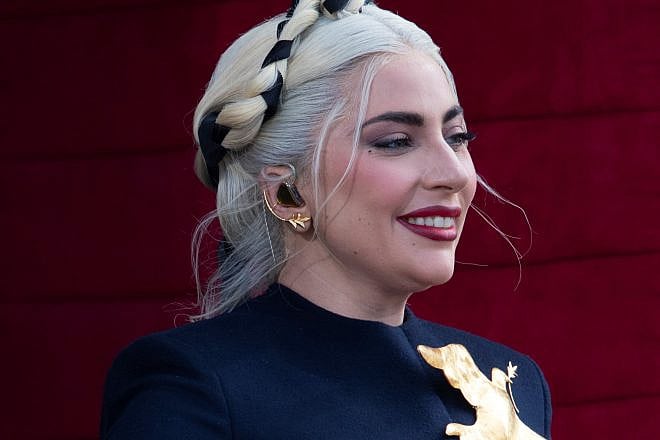 Lady Gaga enters the inauguration platform as she prepares to sing a rendition of “The Star-Spangled Banner” at the 59th Presidential Inauguration ceremony in Washington, D.C., on Jan. 20, 2021. Credit: Department of Defense Photo by Navy Petty Officer 1st Class Carlos M. Vazquez II.