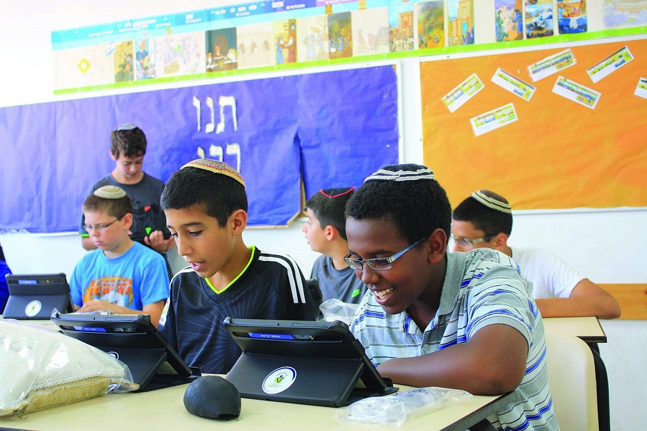 AMIT students learning in the classroom.