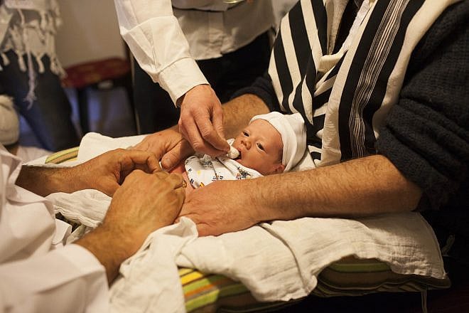 Jews perform a brit milah in Jerusalem on Dec. 12 , 2011. The brit milah is a religious ceremony within Judaism to welcome infant Jewish boys into a covenant between God and the Children of Israel through ritual circumcision performed by a mohel (circumciser), the ceremony takes place on the eighth day of the child's life. Photo by Yonatan Sindel/Flash90.