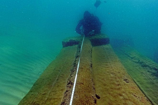 A diver measures the rare cargo near Moshav Beit Yanai. Credit: IAA.