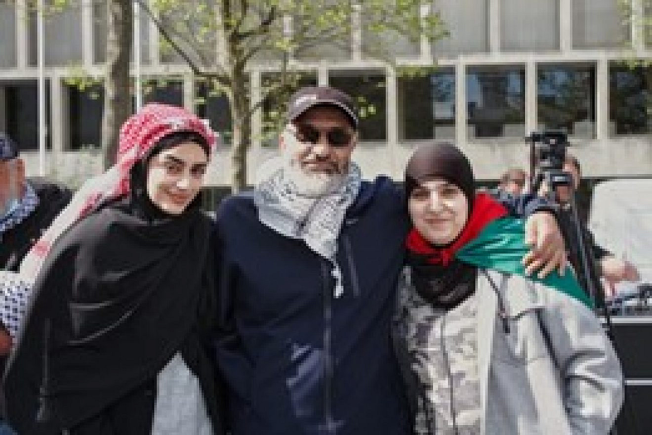 Amin Abu Rashid with his daughters Israa (left) and Iman. Source: Facebook.
