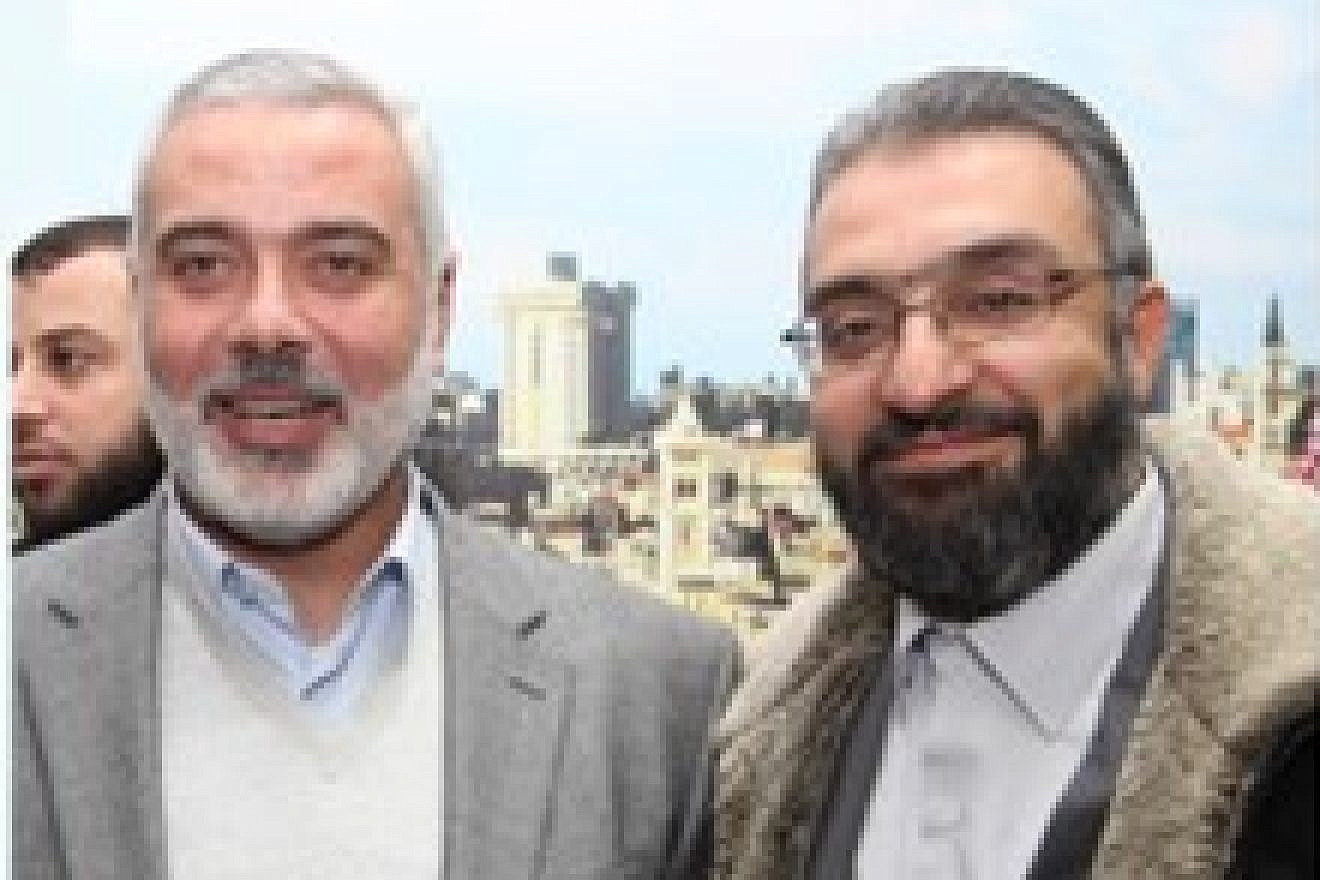 Amin Abu Rashed (right) with Hamas leader Ismail Haniyeh. Source: Facebook.