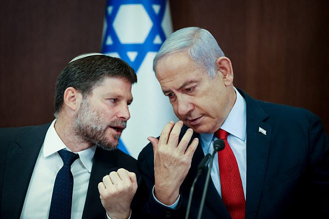 Israeli Finance Minister Bezalel Smotrich speaks with Israeli Prime Minister Benjamin Netanyahu at a Cabinet meeting at the Prime Minister's Office in Jerusalem, on June 18, 2023. Photo by Amit Shabi/POOL.
