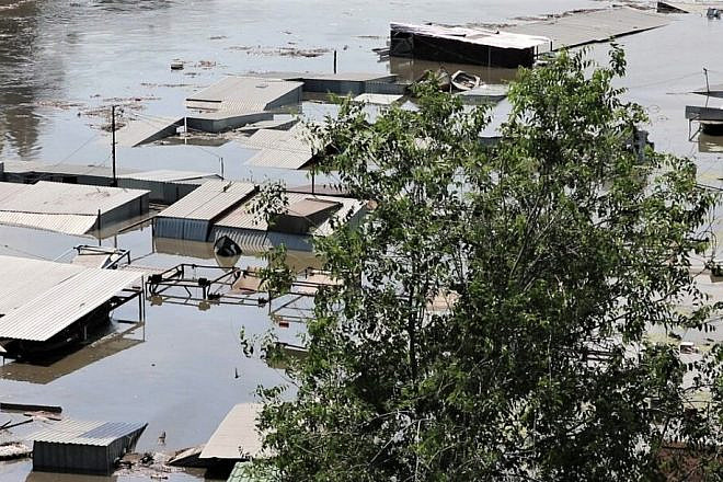 Settlements on the left bank of Dnieper River remain underwater after the Kakhovka Dam was breached on June 6, 2023. Credit: Armyinform via Wikimedia Commons.