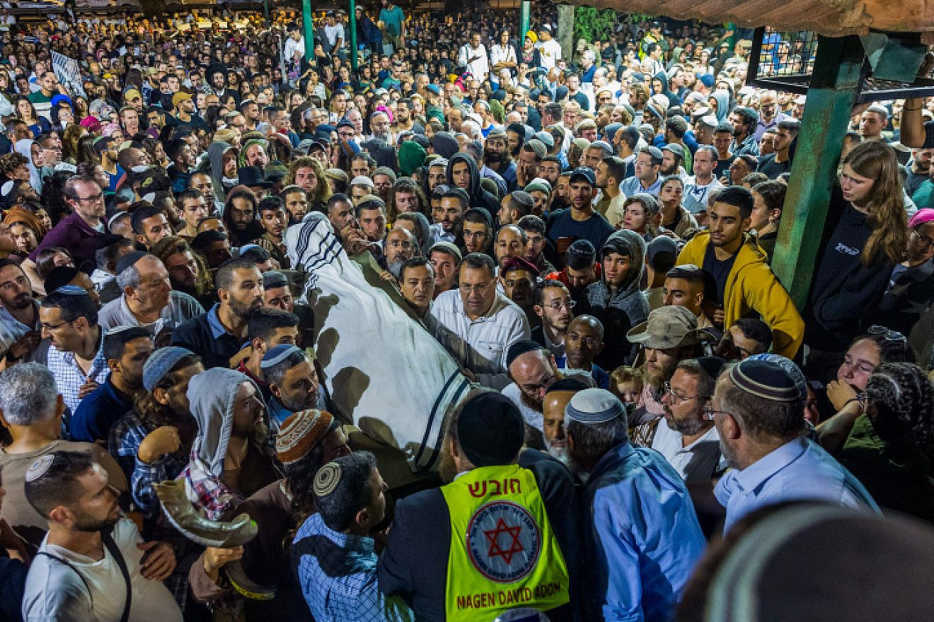 Friends and family attend the funeral of 21-year-old Israeli Harel Masood, who was killed in a terror attack near the near the Jewish settlement of Eli, in the cemetery in Yesodot, on June 20, 2023. Photo by Liron Moldovan/Flash90.