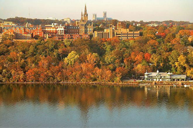 Georgetown University's main campus. Washington National Cathedral is visible above campus, and the Washington Canoe Club is in the lower right on the Potomac River. Credit: Patrickneil via Wikimedia Commons.