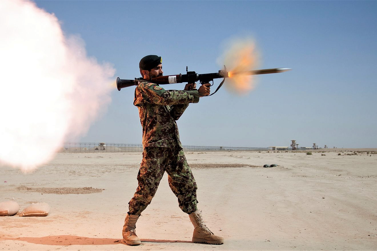 An Afghan National Army (ANA) soldier assigned to the Mobile Strike Force Kandak fires a RPG-7 rocket-propelled grenade launcher during a live-fire exercise supervised by the Marines with the Mobile Strike Force Advisor Team on Camp Shorabak, Helmand province, Afghanistan, May 20, 2013. Credit: U.S. Marine Corps Photo by Staff Sgt. Ezekiel R. Kitandwe via Wikimedia Commons.