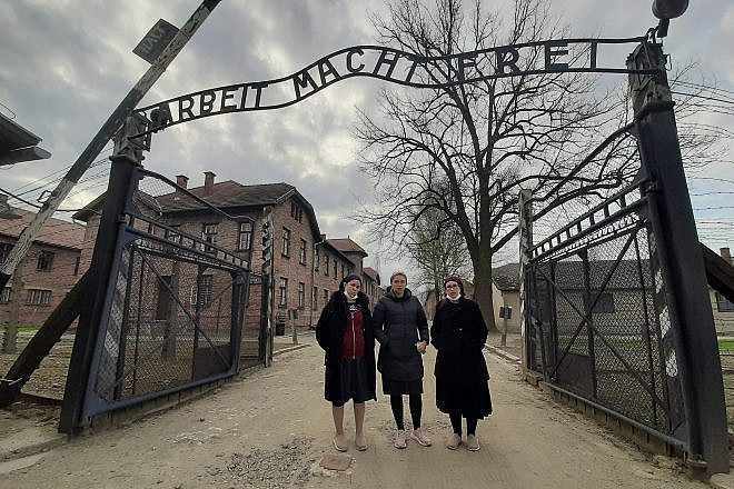 At the entrance to Auschwitz: "Triumph of the Spirit" director Miriam Cohen is flanked by producers Chani Kopilowitz (left) and Yuti Neiman. Credit: Courtesy of Triumph of the Spirit.