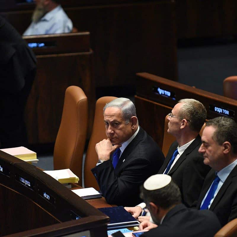 Israeli Prime Minister Benjamin Netanyahu and, from left, Justice Minister Yariv Levin, Energy Minister Israel Katz and National Security Minister Itamar Ben-Gvir (with his back to the camera) attend the votes at the Knesset on proposed changes to the "reasonableness bill," July 24, 2023. Photo by Yoav Dudkevitch/TPS.