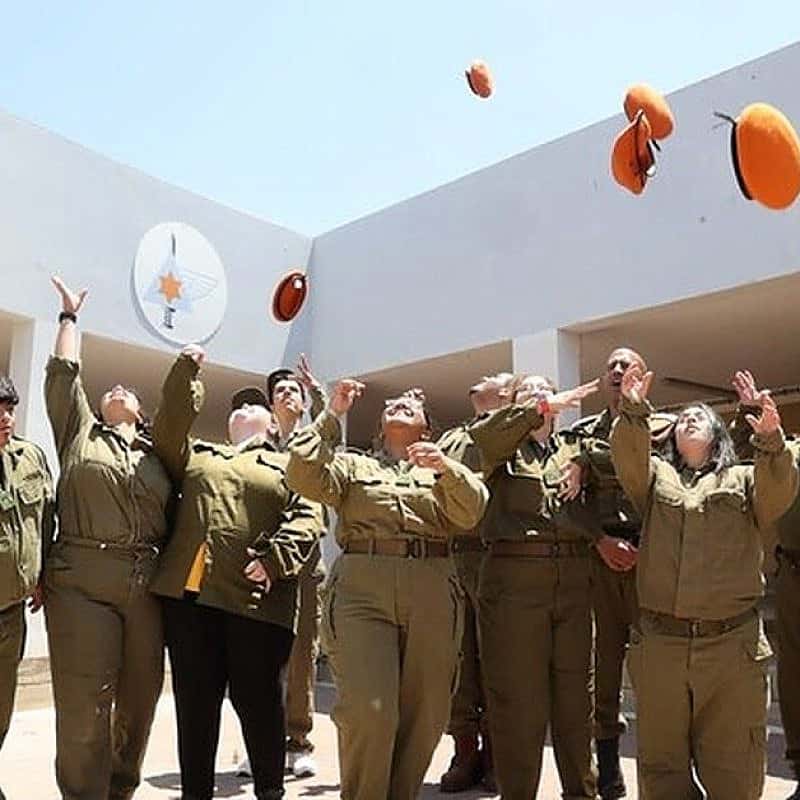 Volunteers from the Special In Uniform program celebrate after completing their "Beret March" at the beginning of their voluntary service in the Israel Defense Forces. Photo by Dani Rife/Special In Uniform.