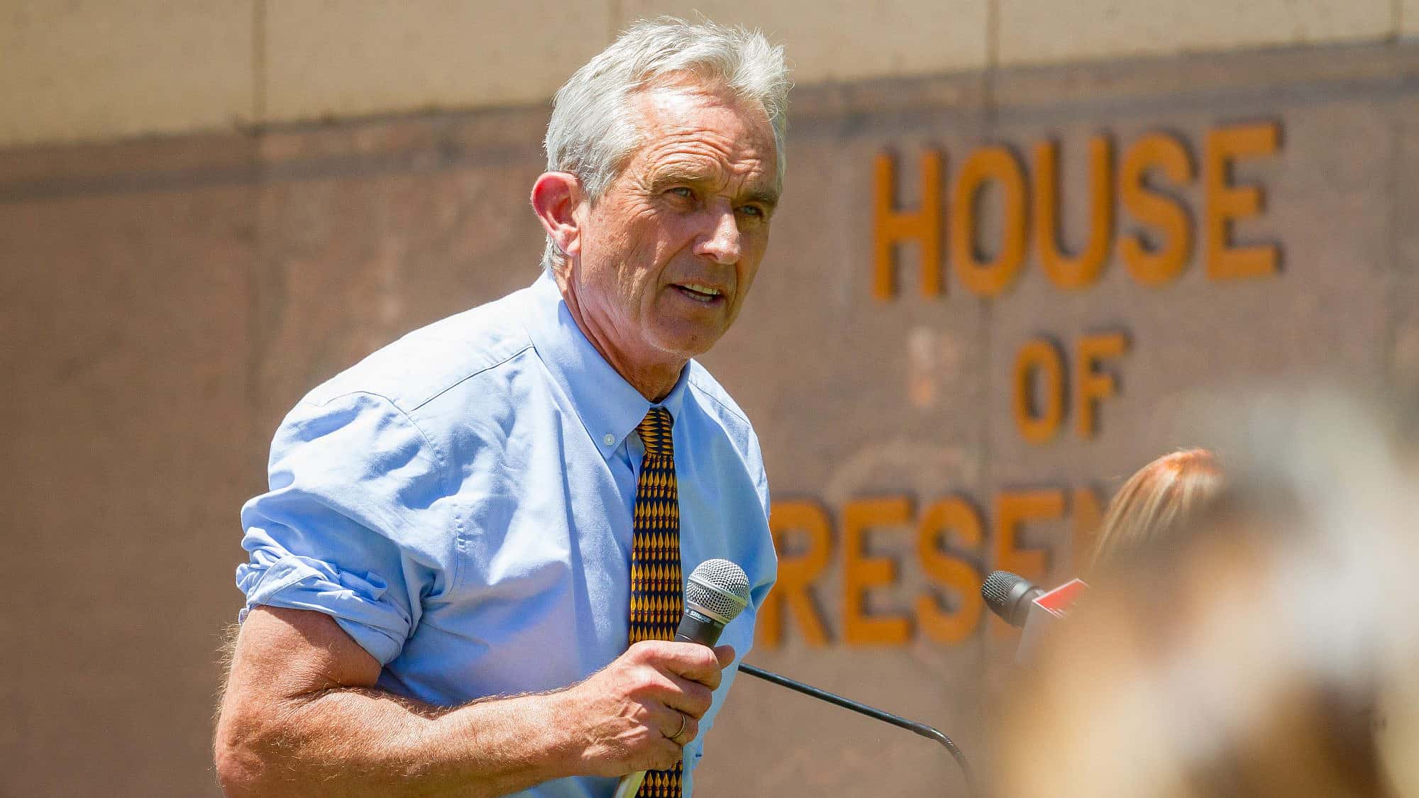 Robert F Kennedy Jr. and sign language interpreter at the Arizona March for Medical Freedom at the State Capitol building. Rally to protect medical rights. Photo by In The Light Photography/Shutterstock.