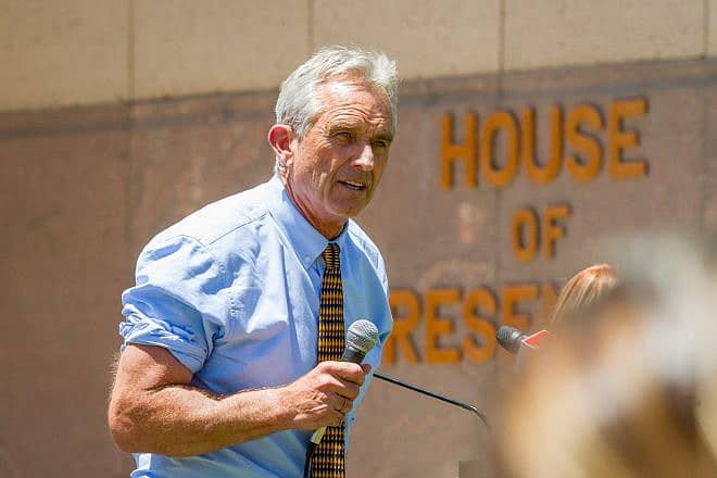 Robert F Kennedy Jr. and sign language interpreter at the Arizona March for Medical Freedom at the State Capitol building. Rally to protect medical rights. Photo by In The Light Photography/Shutterstock.