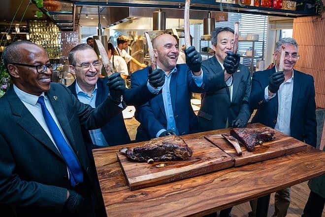 From left: The ambassadors of Kenya, European Union, France, Japan and Argentina attend the invitation-only opening of "Flame" in Tel Aviv, Aug. 8, 2023. Credit: Yuri Skvirski.