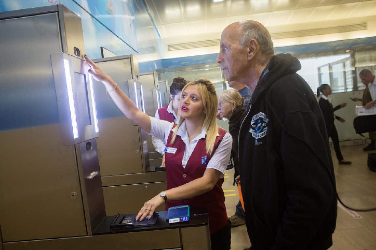 A traveler holding a biometric passport is seen at passport control in the departure hall at Ben-Gurion International Airport, May 20, 2015. Photo by Miriam Alster/Flash90.