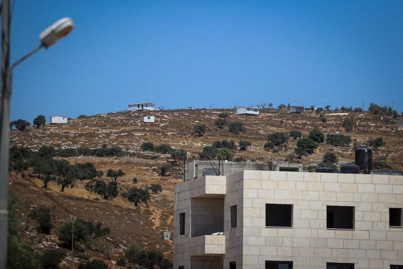 The Jewish community of Oz Zion is seen from Burqa during the funeral of Palestinian Kosai Ma'atan, Aug. 5, 2023. Credit: Flash90.