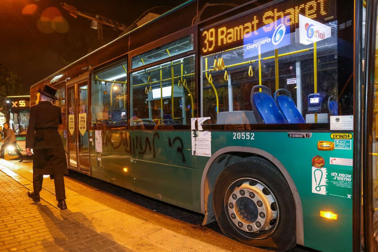 A bus with pictures of women that was vandalized by extreme ultra-Orthodox Jews in the Geula neighborhood of Jerusalem, Aug. 20, 2023. Photo by Chaim Goldberg/Flash90.