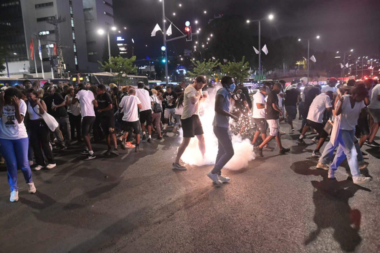Protesters clash with police in Tel Aviv over the handling of a hit-and-run case involving the death of 4-year-old Rafael Adana, Aug. 23, 2023. Photo by Tomer Neuberg/Flash90.