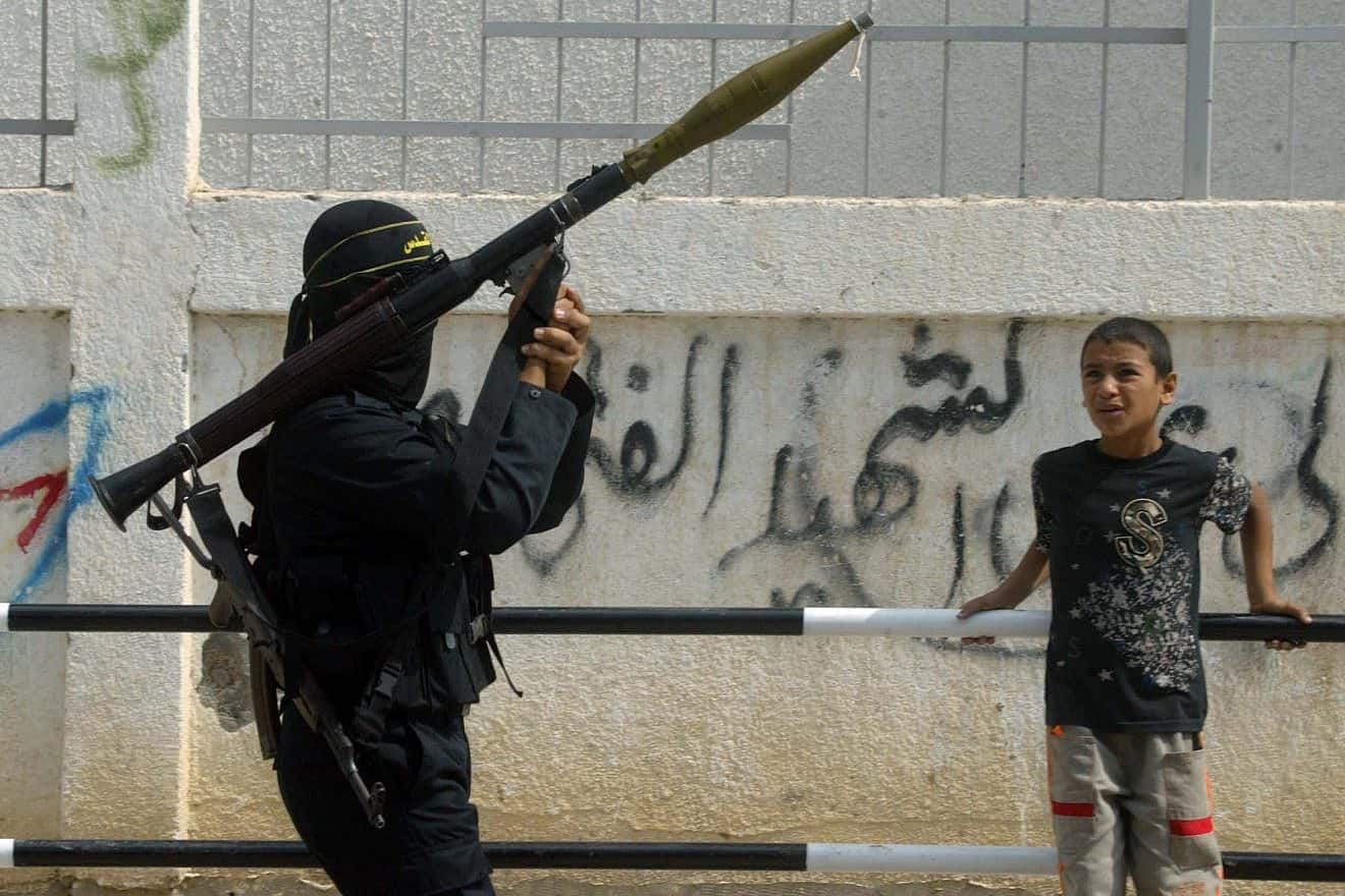 A Palestinian in Gaza holds a rocket launcher. Photo by Ahmad Khateib/Flash90.