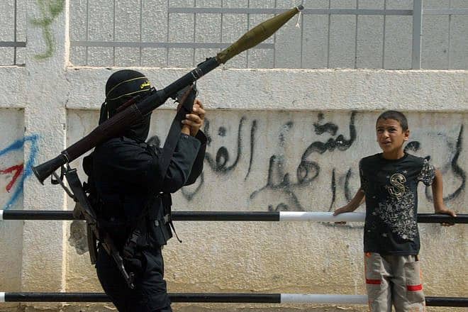 A Palestinian in Gaza holds a rocket launcher. Photo by Ahmad Khateib/Flash90.