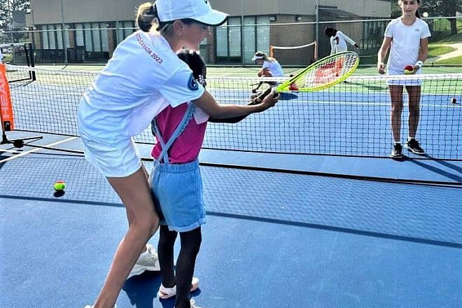 Children get trained in tennis through the Israel Tennis & Education Center. Credit: ITEC.