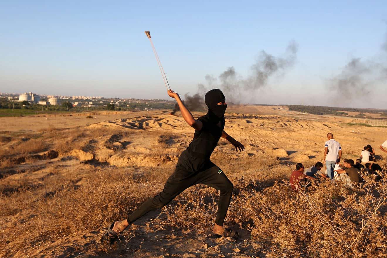 Gazans attack Israeli soldiers at the border fence, east of the Bureij camp in the central Strip, Sept. 24, 2023. Photo by Yousef Mohammed/Flash90.