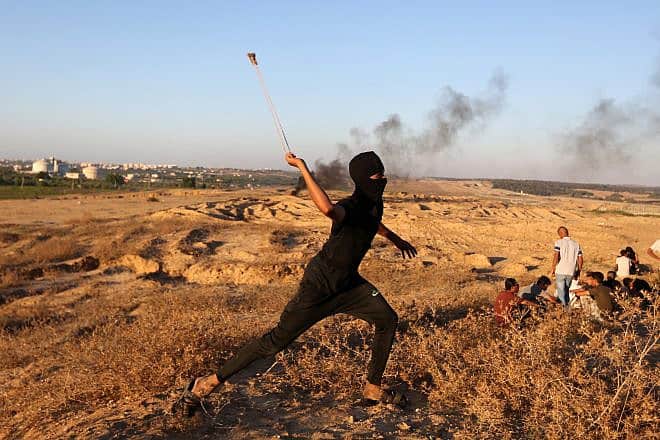 Gazans attack Israeli soldiers at the border fence, east of the Bureij camp in the central Strip, Sept. 24, 2023. Photo by Yousef Mohammed/Flash90.