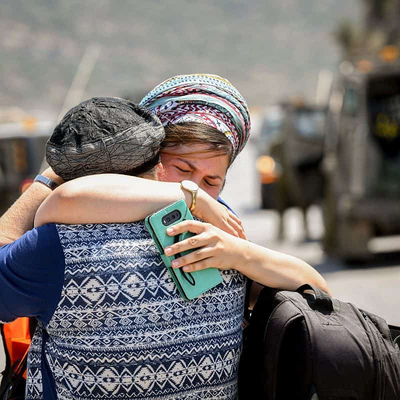 Women at the scene of a terrorist attack near Danny Spring, or Ein Bubin, in the Binyamin region of Samaria on Aug. 23, 2019. A father and his two children were seriously wounded when a grenade or improvised explosive device was thrown at them. Credit: Flash90.