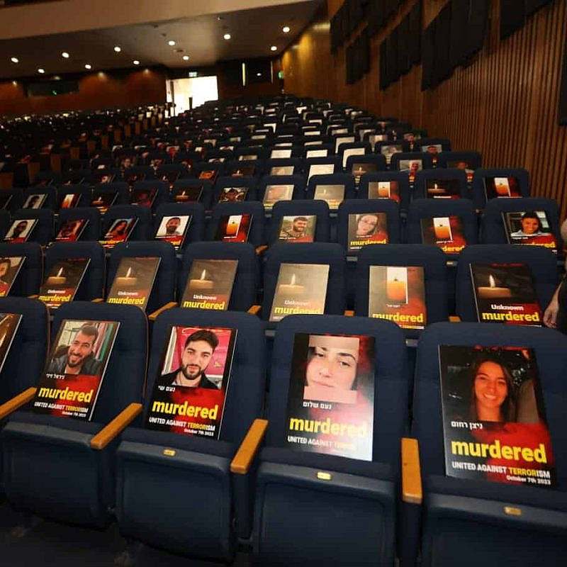 Pictures of more than 1,000 people abducted, missing or killed in the Hamas attack on Oct. 7, 2023 displayed on chairs in Tel Aviv University's Smolarz Auditorium. Credit: Chen Galili/Tel Aviv University.