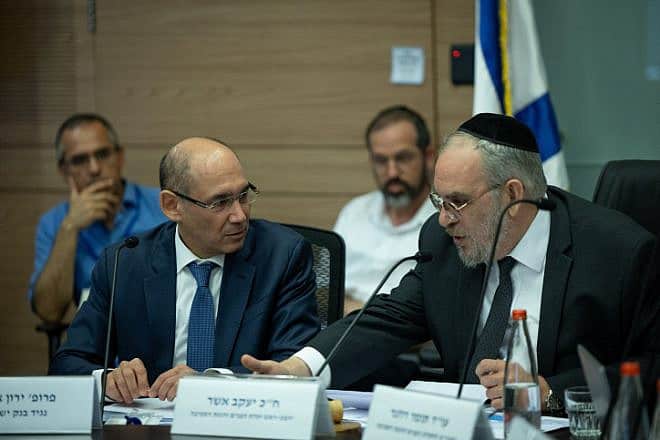 Governor of the Bank of Israel Amir Yaron (left) attends a committee meeting at the Knesset in Jerusalem, July 19, 2023. Photo by Yonatan Sindel/Flash90.