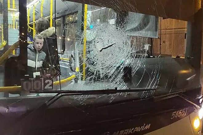 A bus after terrorists stoned it in Judea and Samaria. Credit: Koach LaOvdim.